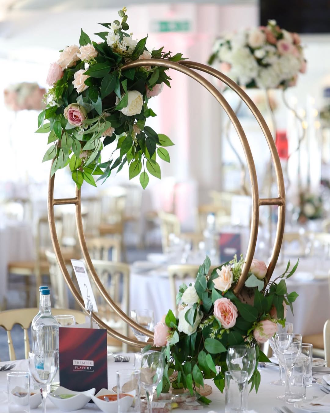 Gold ring centrepiece with blush florals